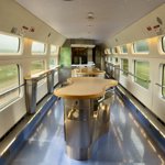 Empty cafeteria car on the Modernisme-style high speed train feels like a spaceship